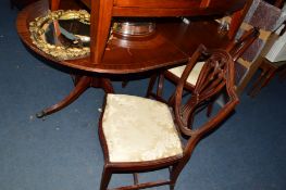 A REPRO MAHOGANY PEDESTAL TABLE with six chairs including two carvers and a serpentine sideboard