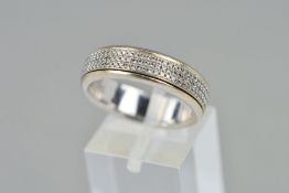 A DIAMOND BAND RING designed as a band ring with central rotating band of brilliant cut diamonds,