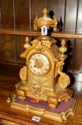A 19TH CENTURY GILT AND ONYX ORMOLU MANTLE CLOCK, 30 hour movement, Roman numerals, on a separate