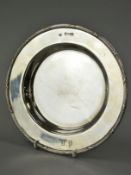 AN EDWARDIAN SILVER CIRCULAR DISH, cast reeded and crossed ribbon border, engraved initials to