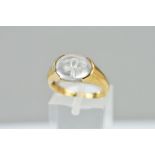 A MODERN 9CT GOLD SINGLE STONE ROCK CRYSTAL RING, oval cabochon with an engraved 'Ank' to the