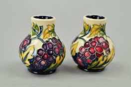 A PAIR OF MOORCROFT MINIATURE VASES, modern grapes and leaf pattern, impressed and painted marks