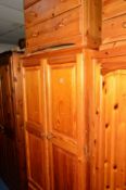 TWO VARIOUS PINE TWO DOOR WARDROBES, one with a single drawer and a pine chest of four long