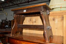 AN OAK STOOL on a stretchered base, a circular barometer marked Beddgelert Snowdonia, Victorian