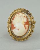 A LATE 20TH CENTURY SHELL CAMEO BROOCH, oval cameo depicting a maiden in profile, twist rope and