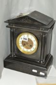 A LATE VICTORIAN BLACK SLATE MANTEL CLOCK OF ARCHITECTURAL FORM, enamel dial with Arabic numerals,