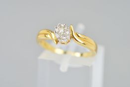 A MODERN 18CT GOLD DIAMOND OVAL CLUSTER CROSSOVER FANCY RING, estimated total diamond weight 0.18ct,