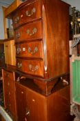 A REPRODUCTION SERPENTINE CHEST of four drawers, a mahogany tall boy, a teak two door cabinet and