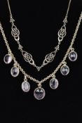 TWO NECKLACES, the first designed as seven graduated oval amethysts to a belcher link chain,