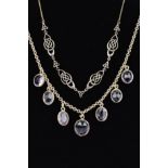 TWO NECKLACES, the first designed as seven graduated oval amethysts to a belcher link chain,