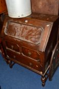 AN OAK FALL FRONT BUREAU, an Edwardian walnut mirror back sideboard, with three central drawers,