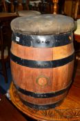 A COOPERED BARREL with later added buttoned seat