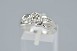 A MODERN PLATINUM DIAMOND RING, centring on a principle modern round brilliant cut diamond,