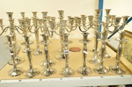 NINE CHROME PLATED CANDELABRUMS, each with four branches and a central sconce, together with seven