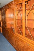 A YEW WOOD THREE SECTION WALL UNIT, approximate width 296cm