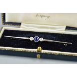 AN EARLY 20TH CENTURY SAPPHIRE AND DIAMOND BAR BROOCH, one round mixed cut blue sapphire measuring