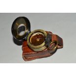 A WHITING EXCHANGE MANCHESTER LIQUID FILLED POCKET COMPASS, with leather pouch, fluid has tainted