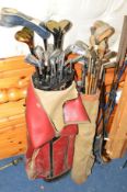 A QUANTITY OF VINTAGE GOLF CLUBS including two bags