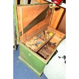 A VINTAGE PAINTED TOOL CHEST CONTAINING TOOLS including wooden moulding planes