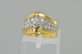 A DIAMOND DRESS RING, designed as two rows of graduated brilliant cut diamonds to the tapered,