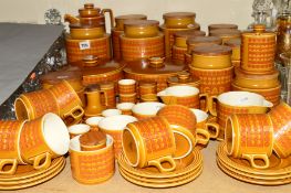 A HORNSEA 'SAFFRON' TWELVE PIECE COFFEE SET together with table wares and storage jars in the same