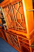 A YEW WOOD GLAZED TWO DOOR SIDE CABINET flanked by four drawers, width 194cm, together with a