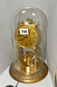 A GERMAN BRASS ANNIVERSARY CLOCK, with glass dome, approximate height 31cm