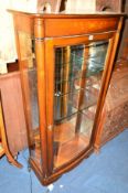 A REPRODUCTION BOW FRONT SINGLE DOOR DISPLAY CABINET (key) and a marble topped occasional table (2)