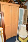 A MODERN BEECH TWO DOOR WARDROBE and two single glazed cabinets (3)