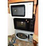 THREE VARIOUS MICROWAVES