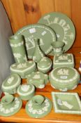 FIFTEEN PIECES OF GREEN WEDGWOOD JASPERWARE, including trinket boxes and covers, pair of dwarf