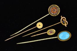 FIVE LATE 19TH TO EARLY 20TH CENTURY STICKPINS, to include a circular carnelian carved as a