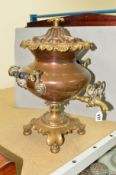 A COPPER AND BRASS SAMOVAR, in classical style on a leaf shaped base with bun feet, approximate