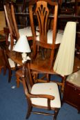A 20TH CENTURY OAK OVAL TOPPED GATE LEG TABLE and six Ducal pine chairs including two carvers (7)