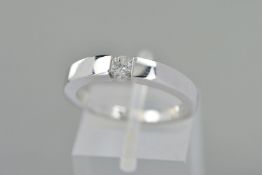 AN 18CT WHITE GOLD SINGLE STONE DIAMOND RING, the brilliant cut diamond to the plain tapered band,