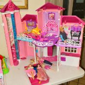 A BARBIE HOUSE AND ACCESSORIES AND FOUR BARBIE DOLLS, together with other dolls