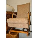 A MID CENTURY UPHOLSTERED ROCKING CHAIR