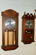 A 20TH CENTURY OAK WALL CLOCK and a modern wall clock (two keys and two pendulums) (2)