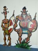 TWO PLYWOOD THEATRE PROPS IN THE FORM OF TWO COMICAL TRIBAL WARRIORS, painted with bones through