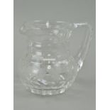 A STUART CRYSTAL WATER JUG, of squat baluster form, etched with a band of fruiting vine, marked '