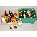 A COLLECTION OF TWENTY THREE BOTTLES AND A SMALL NUMBER OF MINIATURE BOTTLES OF WINES AND SPIRITS to