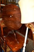 A GEORGIAN MAHOGANY TILT TOP TABLE and a painted standard lamp (2)