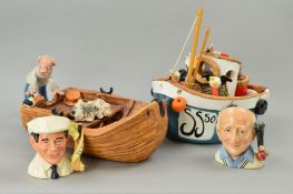 TWO POTTERY FISHING BOATS BY LOUISE THORN, with sail and birds, the other with fisherman pushing