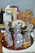 FOUR CUT GLASS DECANTERS, together with cut glass vases, bowl, picture frames, twin handled tray,
