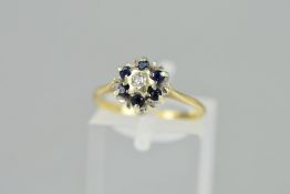 A LATE 20TH CENTURY 9CT GOLD SAPPHIRE AND DIAMOND ROUND CLUSTER RING, ring size M, hallmarked 9ct