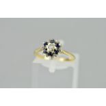 A LATE 20TH CENTURY 9CT GOLD SAPPHIRE AND DIAMOND ROUND CLUSTER RING, ring size M, hallmarked 9ct