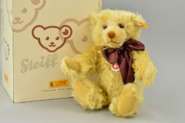 A BOXED STEIFF CLASSIC MILLENIUM TEDDY BEAR, blond mohair, No 003523, with bow, jointed limbs,