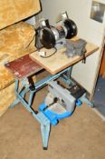 A FOLDING WORKBENCH, a bench grinder, vice and Combi mitre saw