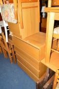 A MODERN LIGHT OAK CHEST of four long drawers and a matching two draw bedside chest (2)