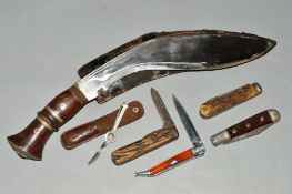 A DAGGER AND PEN KNIVES, the dagger with wooden sheath, together with four penknives, two with